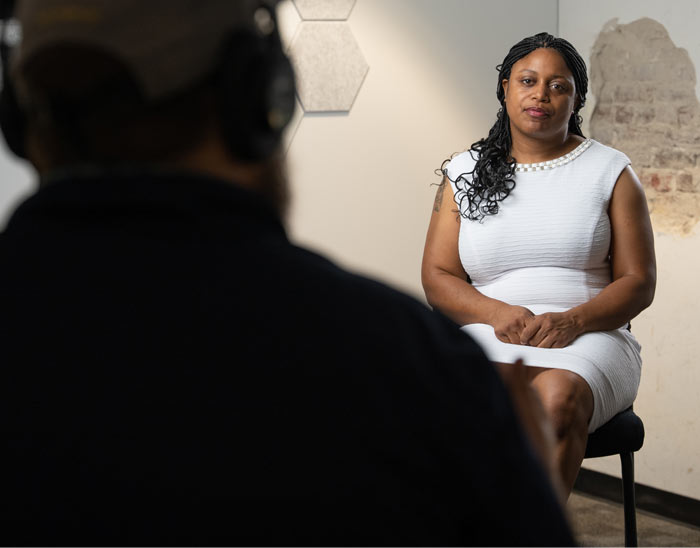 Photo of a woman being interviewed