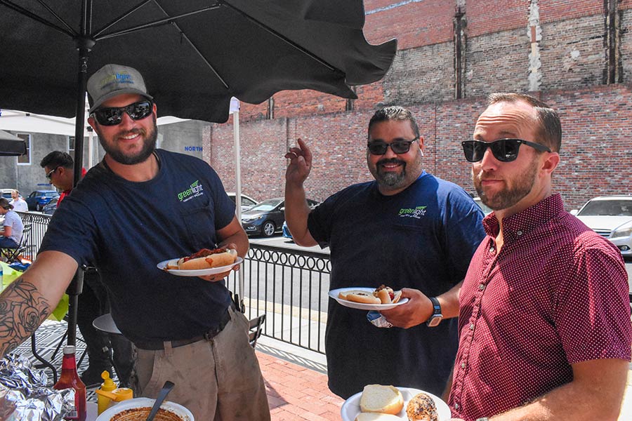 Photo of three men at the Greenlight Ed cookout