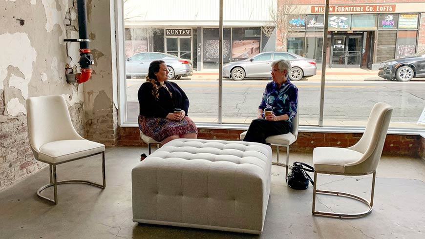 Photo of two women talking at the Gig East space