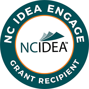 NC Idea Engage Recipient Seal - White sans-serif type inside dark green circle with orange border and NCIDEA Logo in center