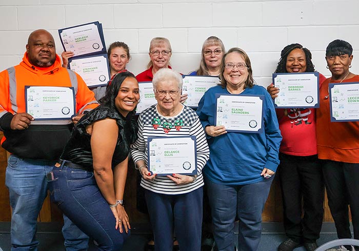 Photo of Navigation East participants holding up certificates
