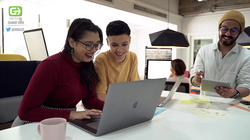 Video still of students using a laptop
