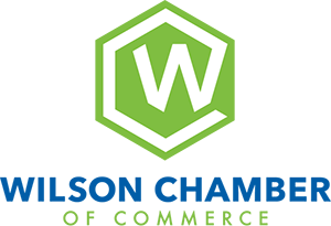 Wilson Chamber of Commerce Logo - Blue and green sans-serif type with stylized W above